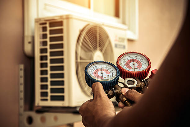 Professional Hvac technician working in Newalla, OK